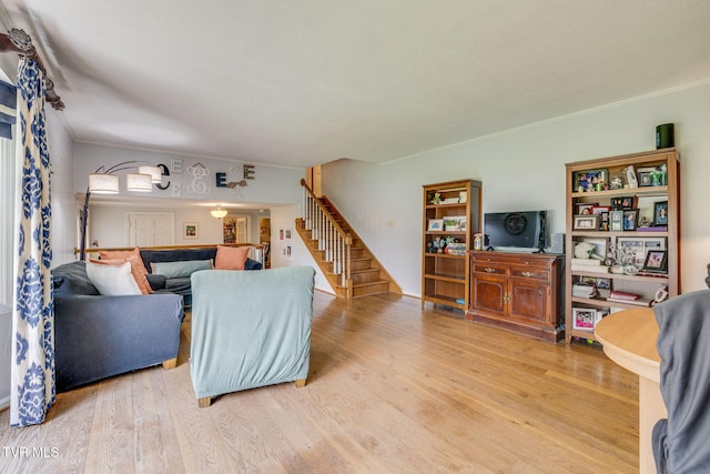 1605 Woodmont Dr, Johnson City, TN 37601 - living room featuring stairs, wood finished floors, and ornamental molding