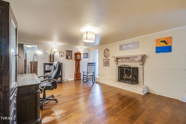 1605 Woodmont Dr, Johnson City, TN 37601 - office area with hardwood / wood-style floors, brick wall, a fireplace with raised hearth, and ornamental molding