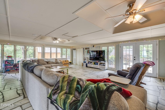 1605 Woodmont Dr, Johnson City, TN 37601 - living area with ceiling fan, french doors, and stone tile floors