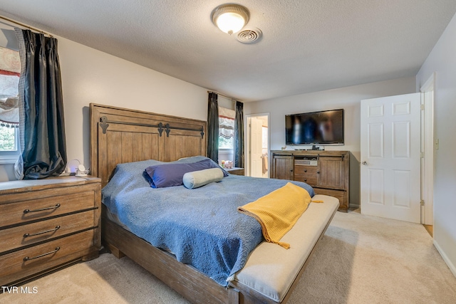 1605 Woodmont Dr, Johnson City, TN 37601 - bedroom with light carpet and a textured ceiling
