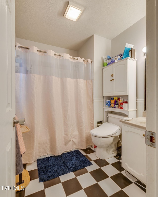 1605 Woodmont Dr, Johnson City, TN 37601 - full bath featuring tile patterned floors, vanity, a textured ceiling, and a shower with curtain
