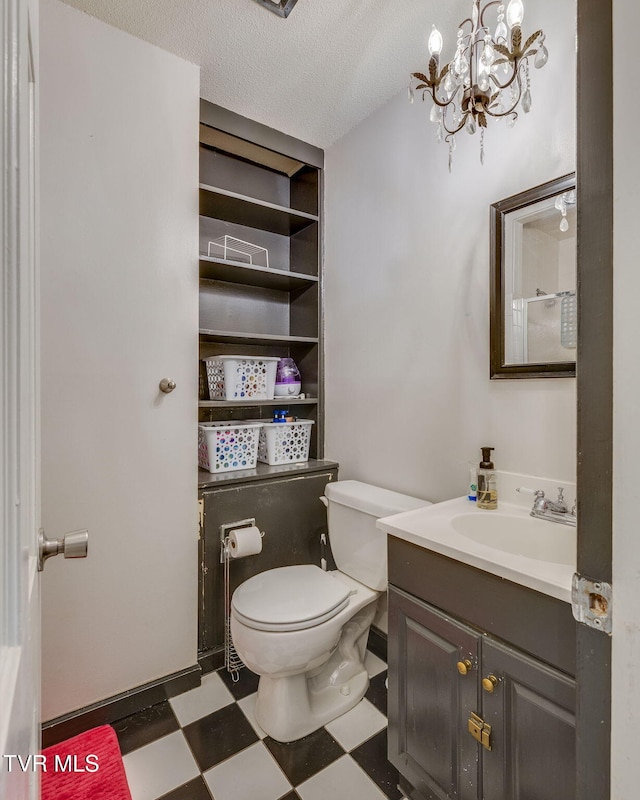 1605 Woodmont Dr, Johnson City, TN 37601 - bathroom featuring tile patterned floors, vanity, a chandelier, and a textured ceiling