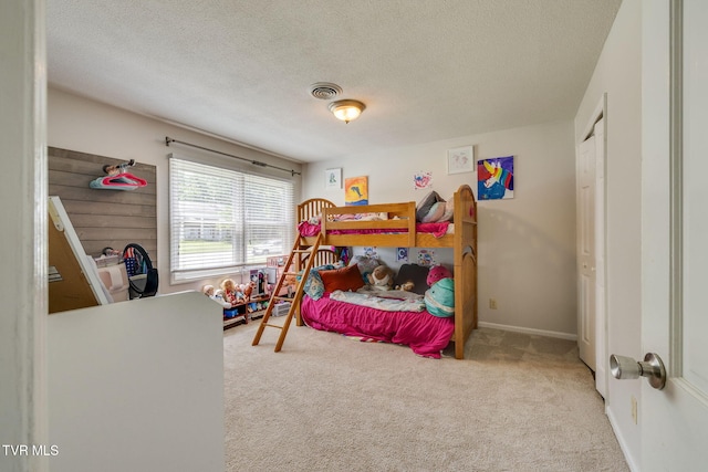 1605 Woodmont Dr, Johnson City, TN 37601 - carpeted bedroom featuring a textured ceiling and a closet