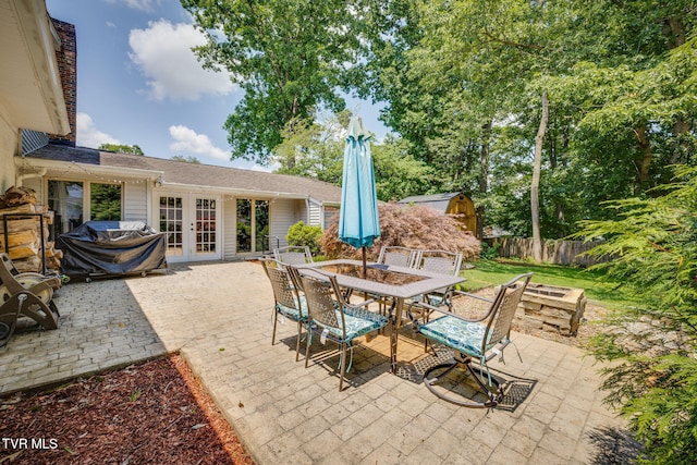 1605 Woodmont Dr, Johnson City, TN 37601 - view of patio with french doors, outdoor dining space, and grilling area