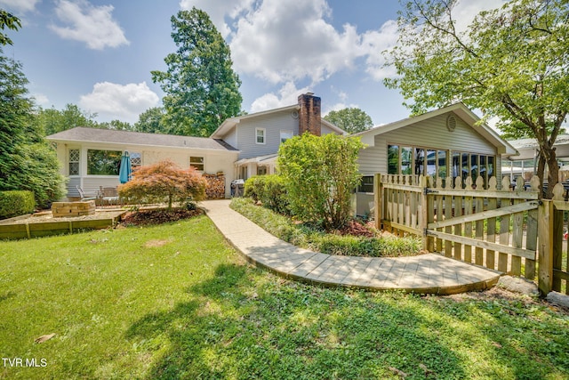 1605 Woodmont Dr, Johnson City, TN 37601 - rear view of house with a chimney and a gate