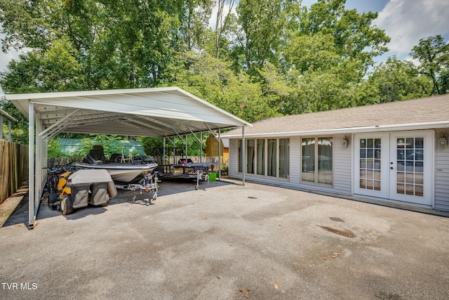 1605 Woodmont Dr, Johnson City, TN 37601 - view of patio featuring a detached carport, asphalt driveway, and french doors