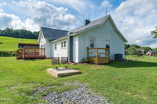 654 W Valley Dr, Kingsport, TN 37664 - back of house featuring a wooden deck, a metal roof, a chimney, and a yard