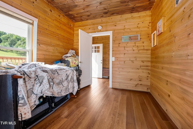654 W Valley Dr, Kingsport, TN 37664 - bedroom with wooden walls, wood-type flooring, and wooden ceiling