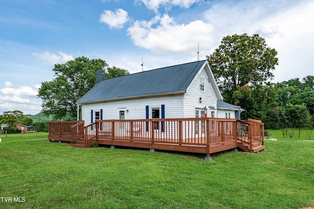654 W Valley Dr, Kingsport, TN 37664 - back of property featuring a metal roof, a wooden deck, a lawn, and a chimney