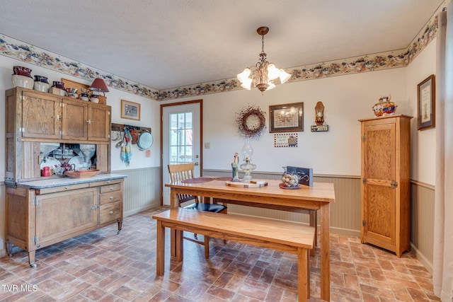 2129 Philon Dr, Kingsport, TN 37660 - dining area featuring a wainscoted wall, a chandelier, and brick patterned flooring