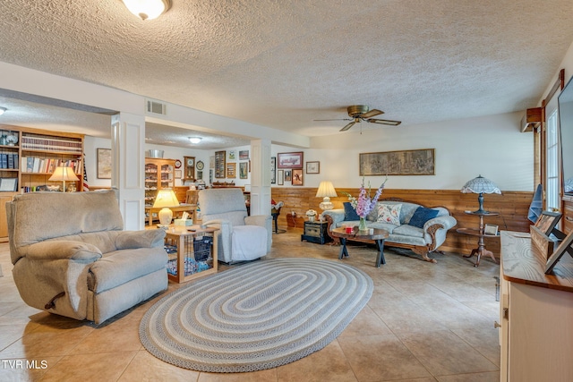 2129 Philon Dr, Kingsport, TN 37660 - living area featuring a textured ceiling, ornate columns, ceiling fan, and light tile patterned flooring