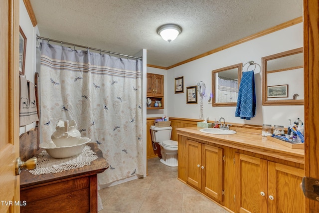 2129 Philon Dr, Kingsport, TN 37660 - bathroom with vanity, a wainscoted wall, a textured ceiling, crown molding, and tile patterned floors