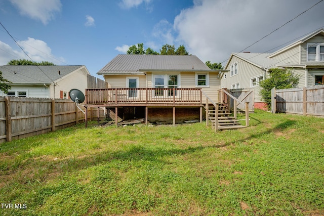 1234 E Center St, Kingsport, TN 37660 - back of house with a wooden deck, a fenced backyard, and a metal roof