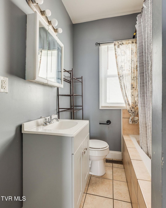 1234 E Center St, Kingsport, TN 37660 - bathroom featuring plenty of natural light, vanity, tile patterned flooring, and tiled shower / bath combo