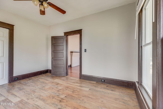 1234 E Center St, Kingsport, TN 37660 - empty room with a ceiling fan and light wood-style flooring