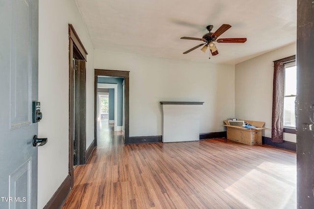 1234 E Center St, Kingsport, TN 37660 - unfurnished living room with wood finished floors and ceiling fan