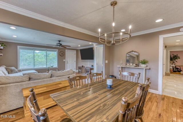 605 Dickerson St, Kingsport, TN 37665 - dining area featuring light wood finished floors, ornamental molding, recessed lighting, a chandelier, and ceiling fan