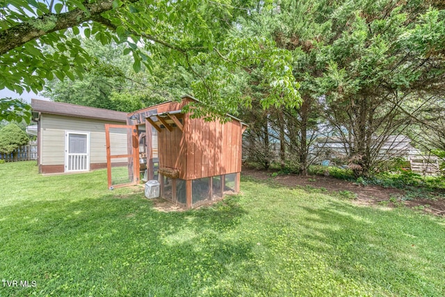 605 Dickerson St, Kingsport, TN 37665 - view of green lawn with exterior structure and an outdoor structure