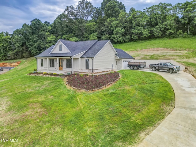 77 Sunset Rd, Johnson City, TN 37615 - view of front of property with concrete driveway, a front yard, and a shingled roof