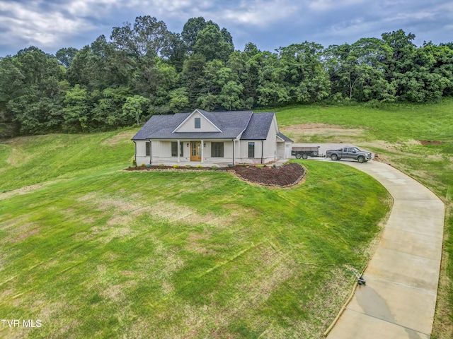 77 Sunset Rd, Johnson City, TN 37615 - view of front of house featuring a porch, a front lawn, and a view of trees
