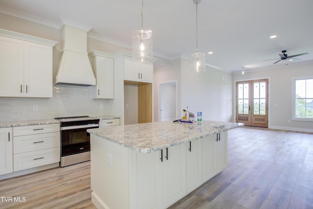 77 Sunset Rd, Johnson City, TN 37615 - kitchen with electric stove, a center island, ornamental molding, recessed lighting, and tasteful backsplash