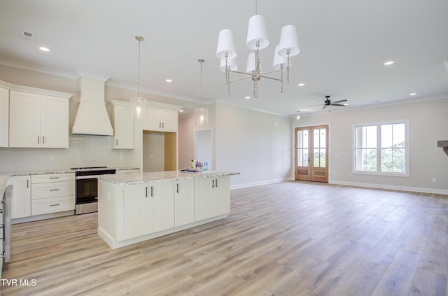 77 Sunset Rd, Johnson City, TN 37615 - kitchen featuring stainless steel range with electric cooktop, a center island, recessed lighting, light wood-style floors, and backsplash