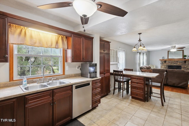 4404 Stillwood Ave, Kingsport, TN 37664 - kitchen featuring dishwasher, ceiling fan, light countertops, a kitchen breakfast bar, and decorative light fixtures