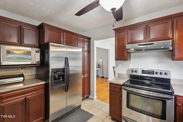 4404 Stillwood Ave, Kingsport, TN 37664 - kitchen featuring stainless steel appliances, under cabinet range hood, and reddish brown cabinets