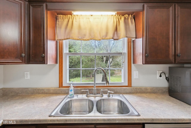 4404 Stillwood Ave, Kingsport, TN 37664 - kitchen featuring light countertops, dishwasher, and dark brown cabinetry