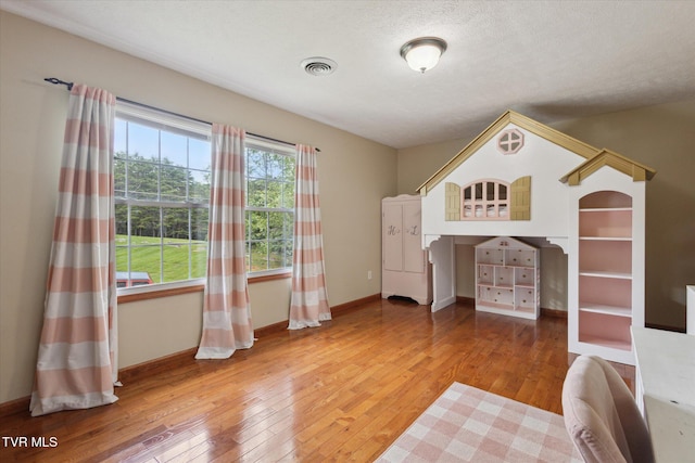 4404 Stillwood Ave, Kingsport, TN 37664 - unfurnished bedroom with hardwood / wood-style flooring and a textured ceiling