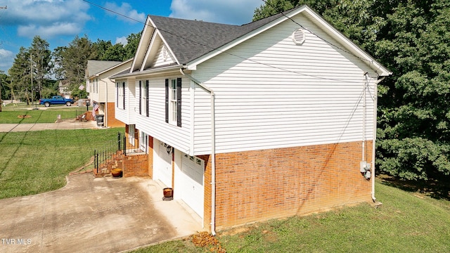 5630 Orebank Rd, Kingsport, TN 37664 - view of property exterior featuring brick siding, a lawn, an attached garage, concrete driveway, and roof with shingles