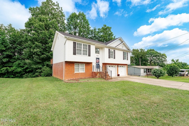 5630 Orebank Rd, Kingsport, TN 37664 - bi-level home featuring driveway, brick siding, a garage, and a front yard