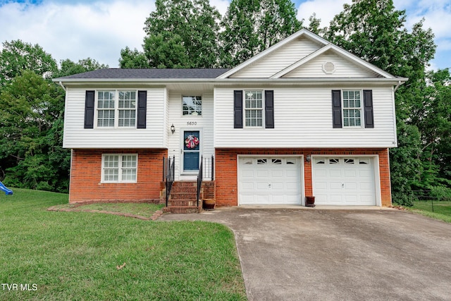 5630 Orebank Rd, Kingsport, TN 37664 - split foyer home with a garage, driveway, brick siding, and a front yard