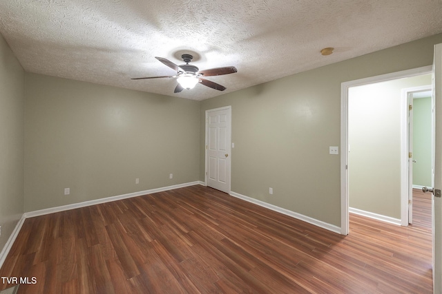 5630 Orebank Rd, Kingsport, TN 37664 - empty room featuring dark wood-style flooring, ceiling fan, a smoke detector, and a textured ceiling