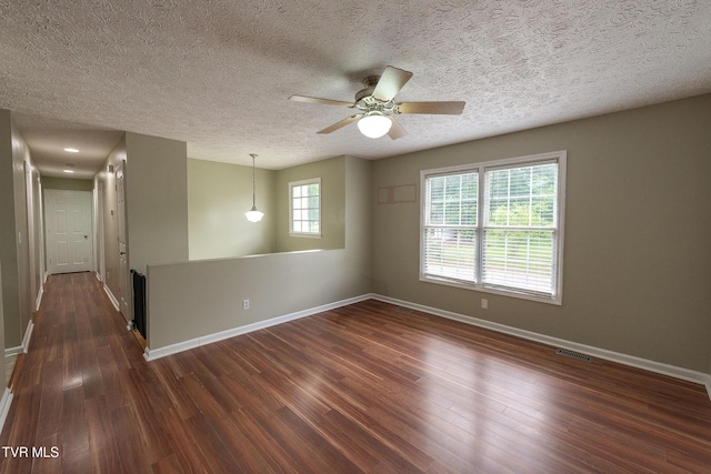 5630 Orebank Rd, Kingsport, TN 37664 - spare room featuring dark wood finished floors, ceiling fan, and a textured ceiling