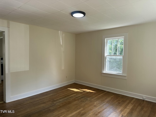 613 Spruce St, Johnson City, TN 37601 - unfurnished room featuring dark wood-style flooring and baseboards