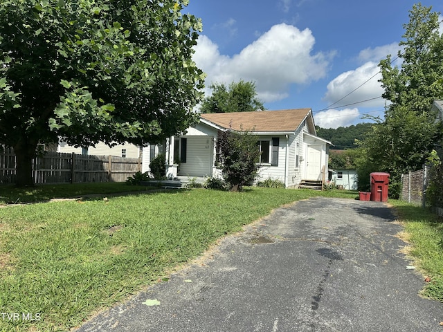 613 Spruce St, Johnson City, TN 37601 - view of front facade featuring entry steps, asphalt driveway, and a shingled roof