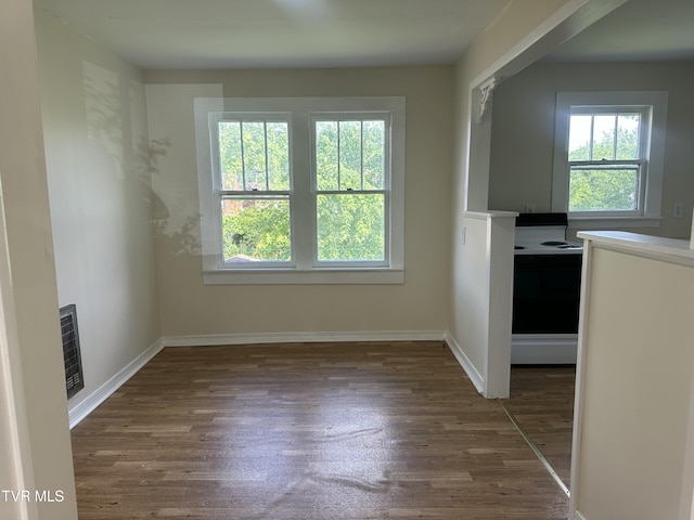 613 Spruce St, Johnson City, TN 37601 - unfurnished dining area with wood finished floors and baseboards