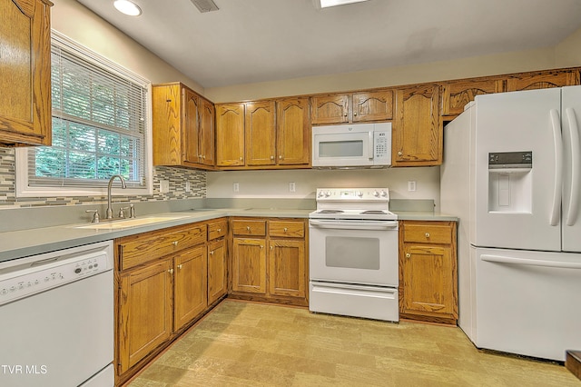 2425 E Lakeview Dr Unit 1, Johnson City, TN 37601 - kitchen featuring white appliances, brown cabinets, light countertops, and recessed lighting