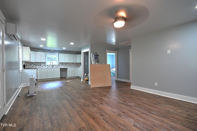 21209 Lime Hill Rd, Bristol, VA 24202 - kitchen featuring a wall mounted air conditioner, dark wood-style flooring, backsplash, white cabinets, and recessed lighting