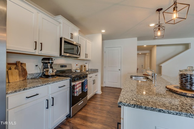 1244 Stamp Lodge Rd, Kingsport, TN 37660 - kitchen featuring stainless steel appliances, dark wood-style floors, light stone countertops, white cabinetry, and recessed lighting