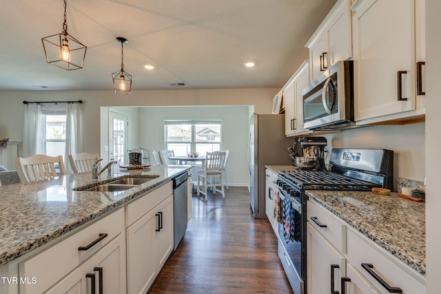 1244 Stamp Lodge Rd, Kingsport, TN 37660 - kitchen with stainless steel appliances, white cabinets, dark wood-type flooring, pendant lighting, and recessed lighting