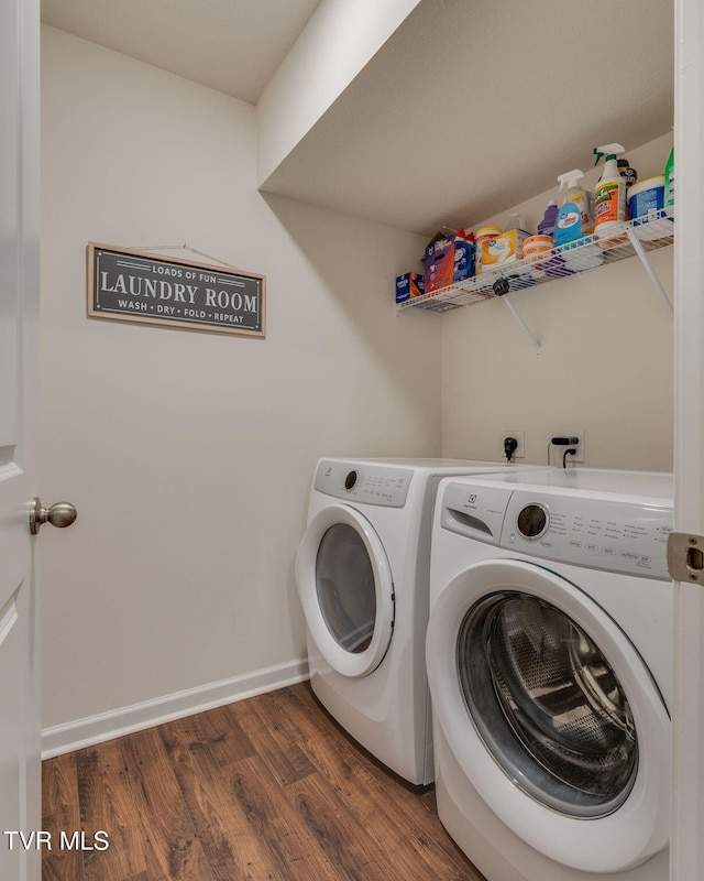 1244 Stamp Lodge Rd, Kingsport, TN 37660 - washroom with washing machine and dryer and wood finished floors