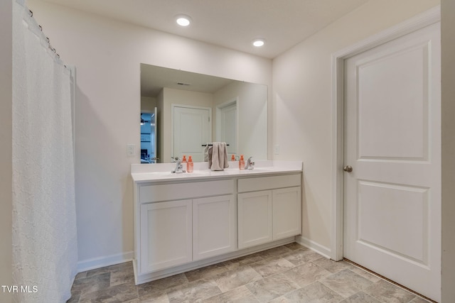 1244 Stamp Lodge Rd, Kingsport, TN 37660 - full bathroom with double vanity and baseboards