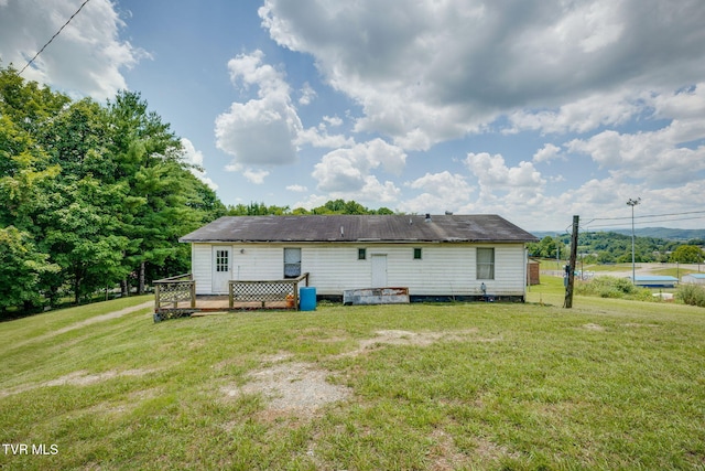212 Circle, Castlewood, VA 24224 - back of property featuring a lawn and a wooden deck