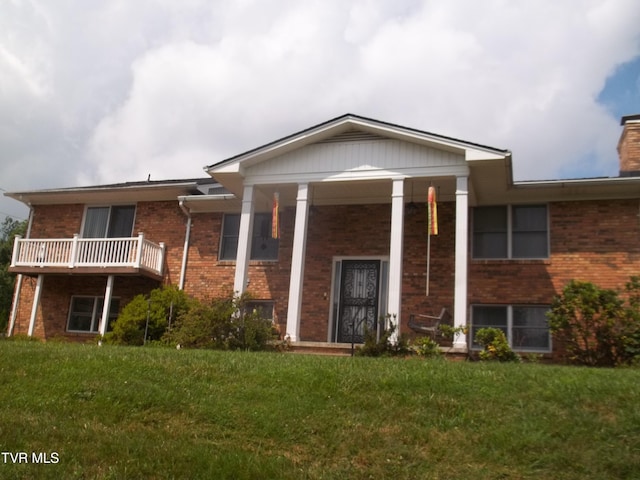 313 Milburn Ave, Kingsport, TN 37660 - greek revival inspired property with brick siding, a front lawn, and a chimney