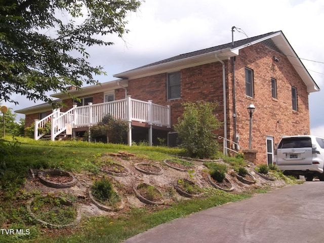 313 Milburn Ave, Kingsport, TN 37660 - view of side of home featuring brick siding and a wooden deck