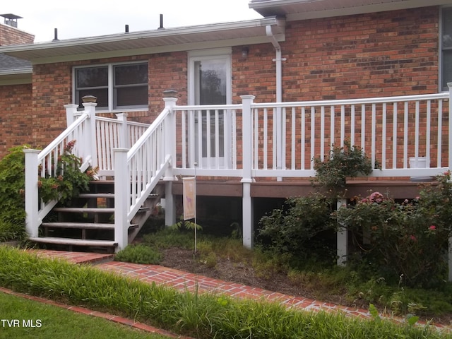 313 Milburn Ave, Kingsport, TN 37660 - view of exterior entry featuring brick siding and a deck