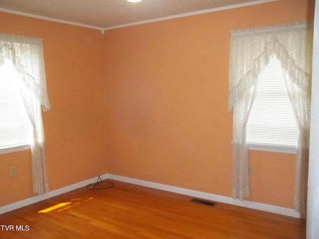 313 Milburn Ave, Kingsport, TN 37660 - spare room featuring wood finished floors and ornamental molding