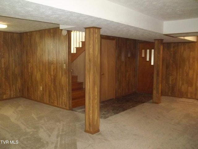 313 Milburn Ave, Kingsport, TN 37660 - finished basement featuring wooden walls, carpet floors, stairway, and a textured ceiling